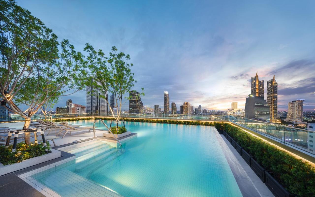Grande Centre Point Surawong Bangkok Hotel Exterior photo The rooftop pool at The River